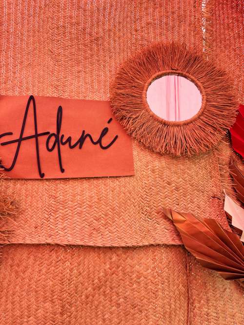 A handwoven raffia mirror designed to soften your space.12-inch round raffia-framed wall mirror