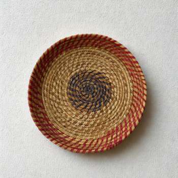 Natural raffia tray with subtle purple detailing, handmade for modern living.