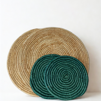 Beige handwoven placemats with green trivets styled on dining table. Natural fiber table set featuring two beige placemats and two green trivets. Minimalist table decor set in beige and green tones, handmade finish. Eco-friendly woven table accessories for elegant dining spaces.